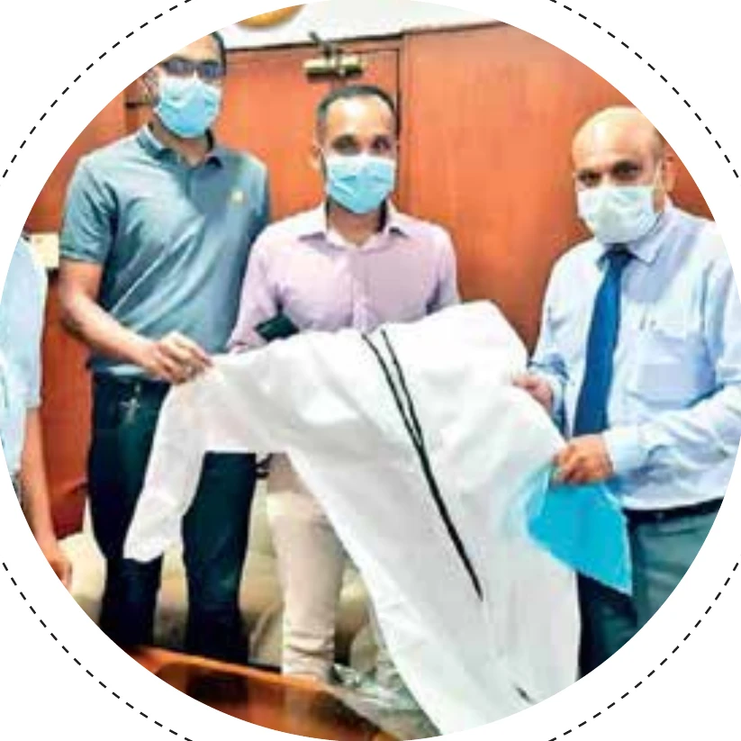 MAS Silueta team handing over a coat during the Dare to Be Bald initiative in Semarang, Indonesia