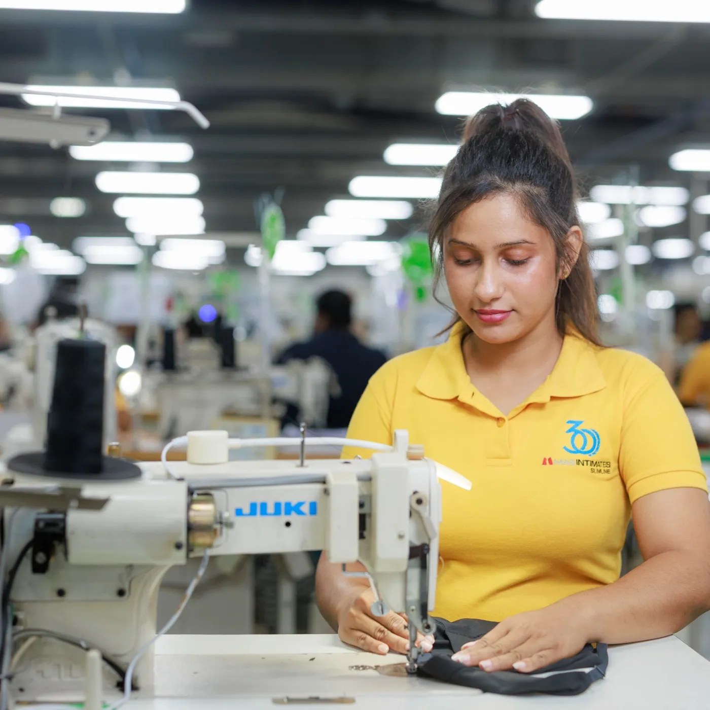 MAS team member at a sewing machine