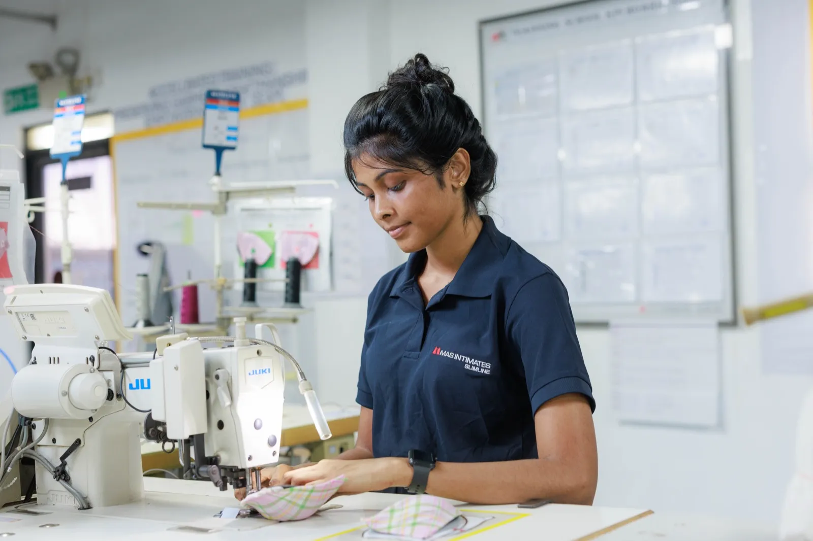 MAS team member at a sewing machine